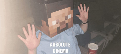 a person wearing a cardboard box on their head with absolute cinema written on the bottom
