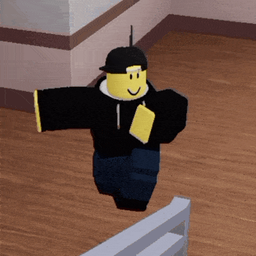 a roblox character wearing a black hoodie and a black hat is walking on a wooden floor