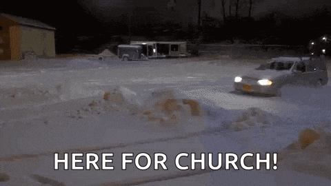 a car is driving through the snow with the words `` here for church '' .