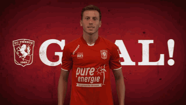 a man in a red shirt with pure energie written on it