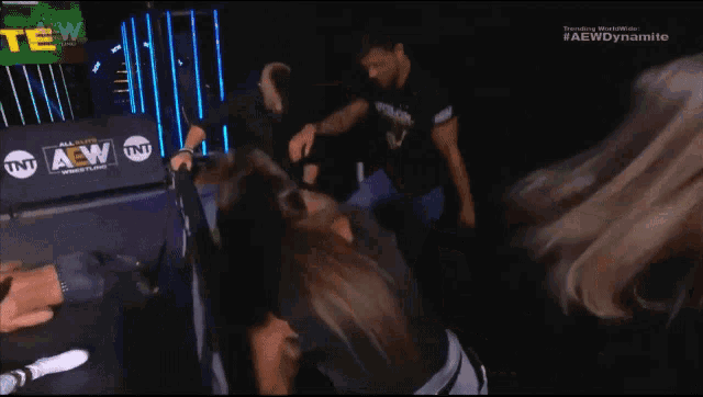 a group of people are standing next to each other on a stage in a room .