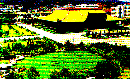 an aerial view of a large building with a yellow roof