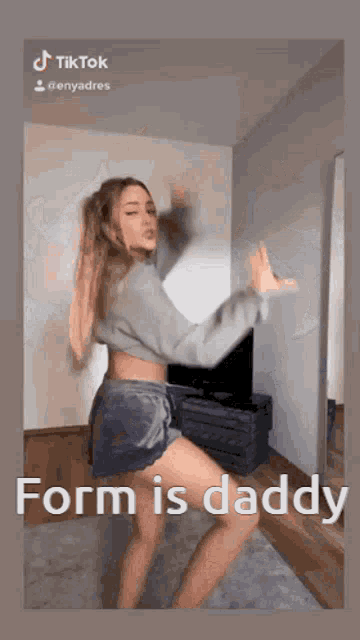 a woman is dancing in a room with the words form is daddy on the bottom