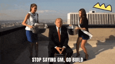 two women carrying buckets next to a man with the words stop saying gm go build