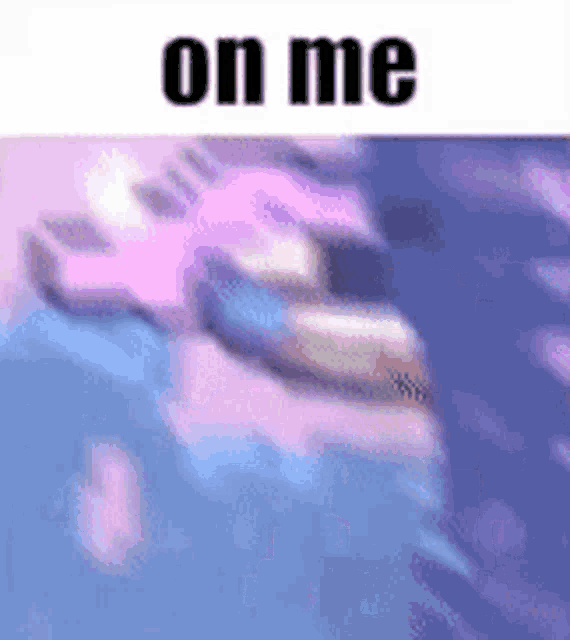 a blurry picture of a person with the words `` on me '' on top of it .