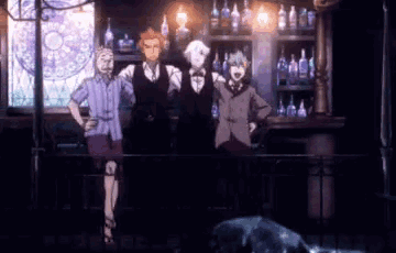 a group of people standing in front of a bar with bottles on the shelves .