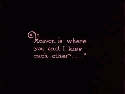 heaven is where you and i kiss each other written in pink on a black background