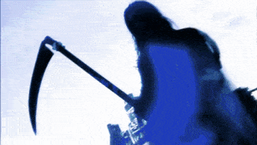 a silhouette of a person holding a scythe against a blue sky