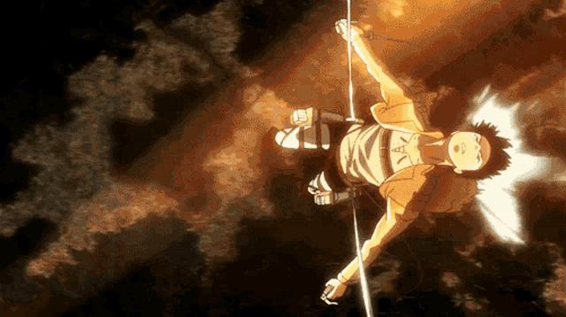 a man is hanging upside down in the air while holding a sword
