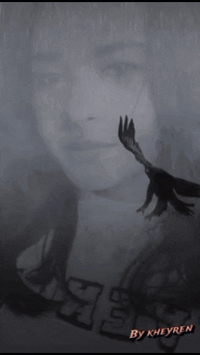 a black and white photo of a woman with a crow behind her and the word fuji