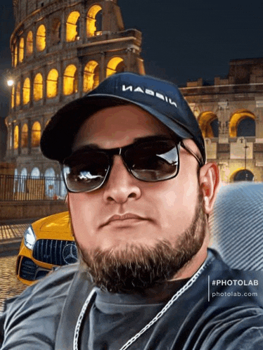 a man with a beard wearing sunglasses and a hat that says ' massive ' on it