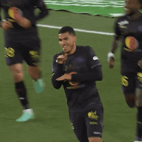 a soccer player with the number 6 on his shorts is running on the field