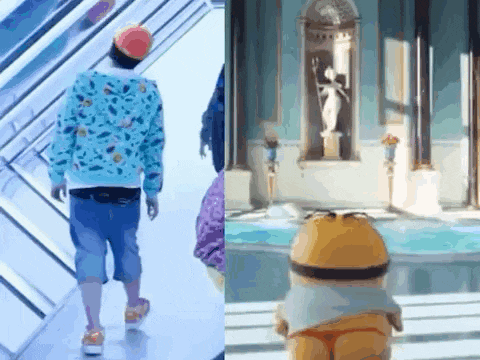 a man in a blue sweatshirt is walking down an escalator next to a cartoon character .