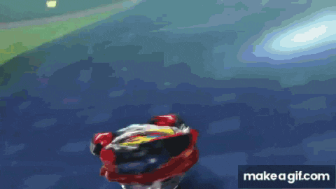 a spinning top is flying through the air on a blue surface .