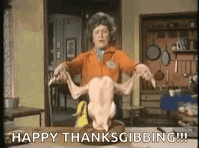 a woman is holding a dead chicken on a table and says `` happy thanksgibbing '' .