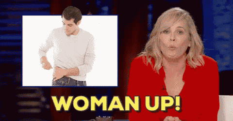 a woman in a red sweater says woman up