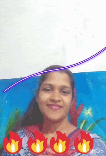 a woman is smiling in front of a blue background with flames around her face