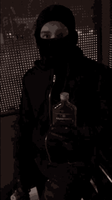 a blurred image of a person kneeling on the floor with blood on the floor