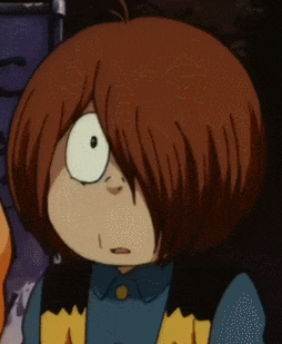 a close up of a cartoon character with brown hair and a yellow vest