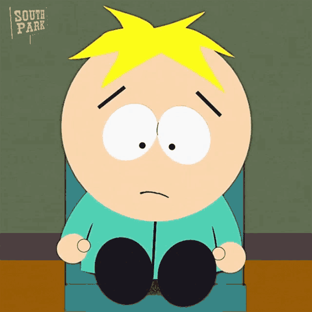 a south park character is sitting in a chair
