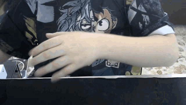 a person wearing a t-shirt that has a cartoon character on it
