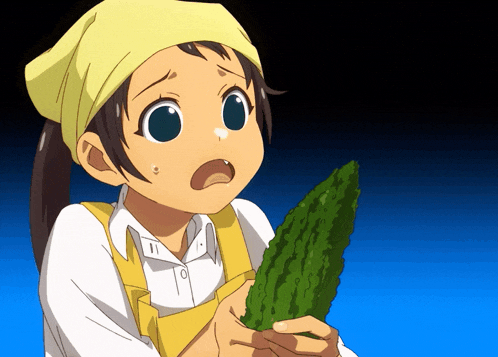 a girl with a yellow headband is holding a green object