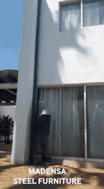 a picture of a building with the words madensa steel furniture