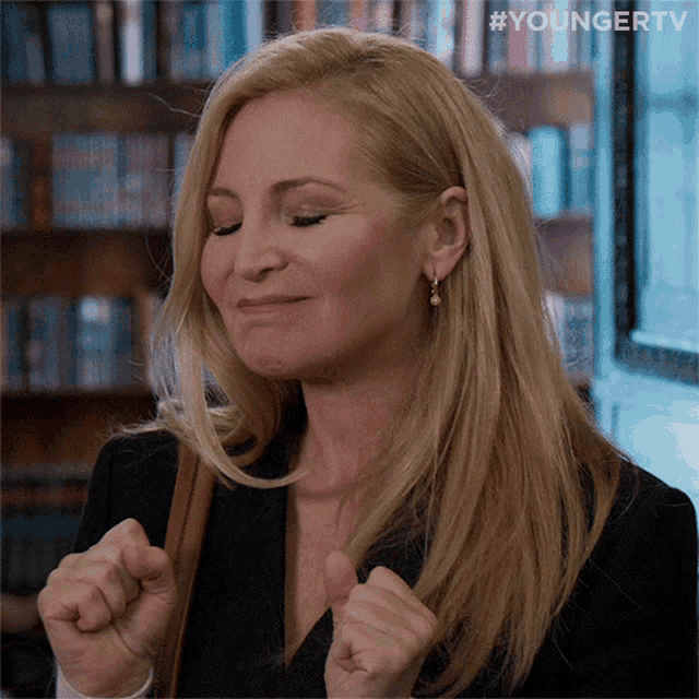 a woman 's face is shown with the hashtag #youngertv behind her