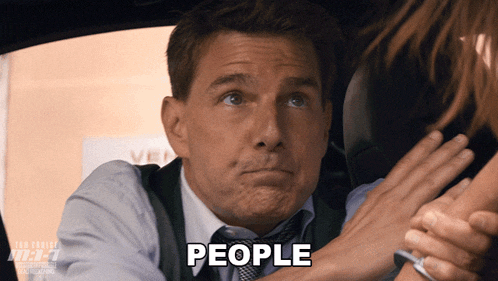 a man in a suit and tie with the word people written on his face