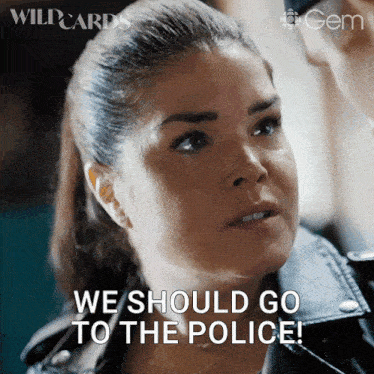 a woman says " we should go to the police " in front of a man