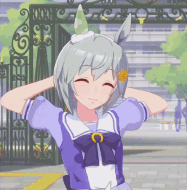 a girl with a green horn is smiling in front of a gate that says tokyo