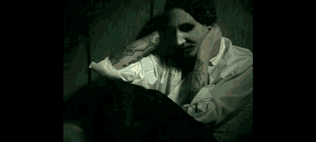 a close up of a woman 's face with blood coming out of it .
