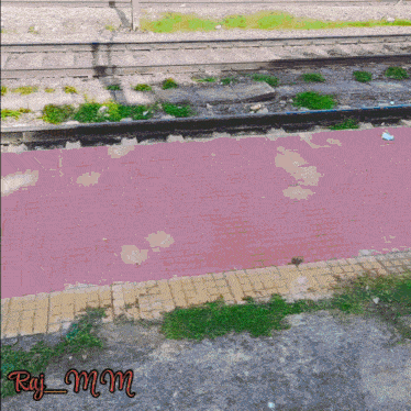 a picture of a train track with the name raj mm on the bottom right
