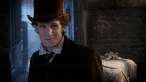 a man wearing a top hat and tie with the words " those were the days " above him