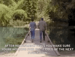 two men are walking across a bridge with a caption that says after your friend tells you make sure youre holding shit