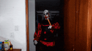 a scary clown with the letter a on his head