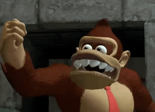 donkey kong is wearing a red tie and has a big smile on his face
