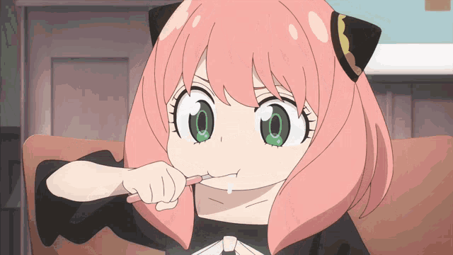 a girl with pink hair is brushing her teeth