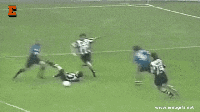 a soccer game is being played on a field with the website mugifs.net in the corner