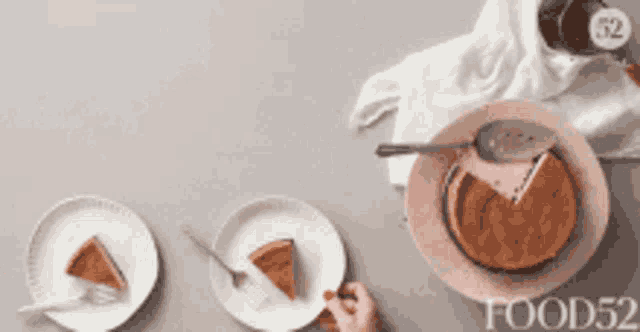 a person is taking a slice of cake from a plate with a fork ..