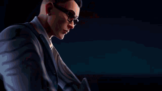a man with glasses is holding a purple and yellow object