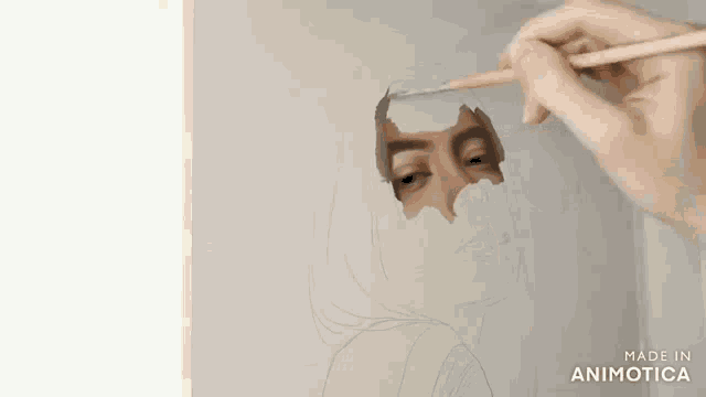 a person is drawing a woman 's face with a pencil on a piece of paper .