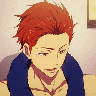 a man with red hair and yellow eyes is laying down