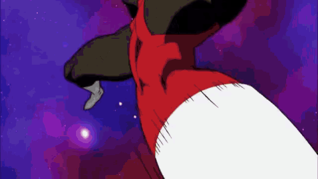 a person 's hand is reaching out towards a red object in the sky .
