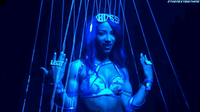 a woman in a bikini with a ring that says legit on her finger