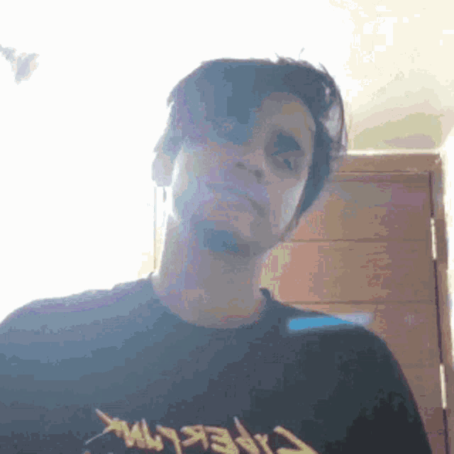 a man wearing a black shirt that says cyberpunk