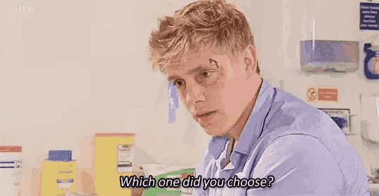 a man with a scar on his forehead is asking which one did you choose in a hospital room .
