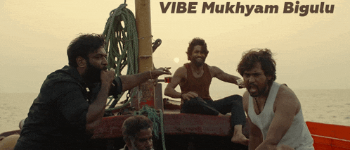 a group of men sitting on a boat with the words vibe mukham bigulu below them