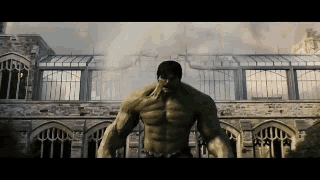 a hulk is standing in front of a building
