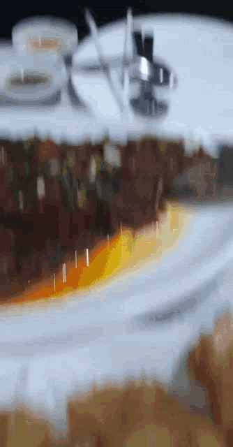 a close up of a plate of food on a table with a blurred background
